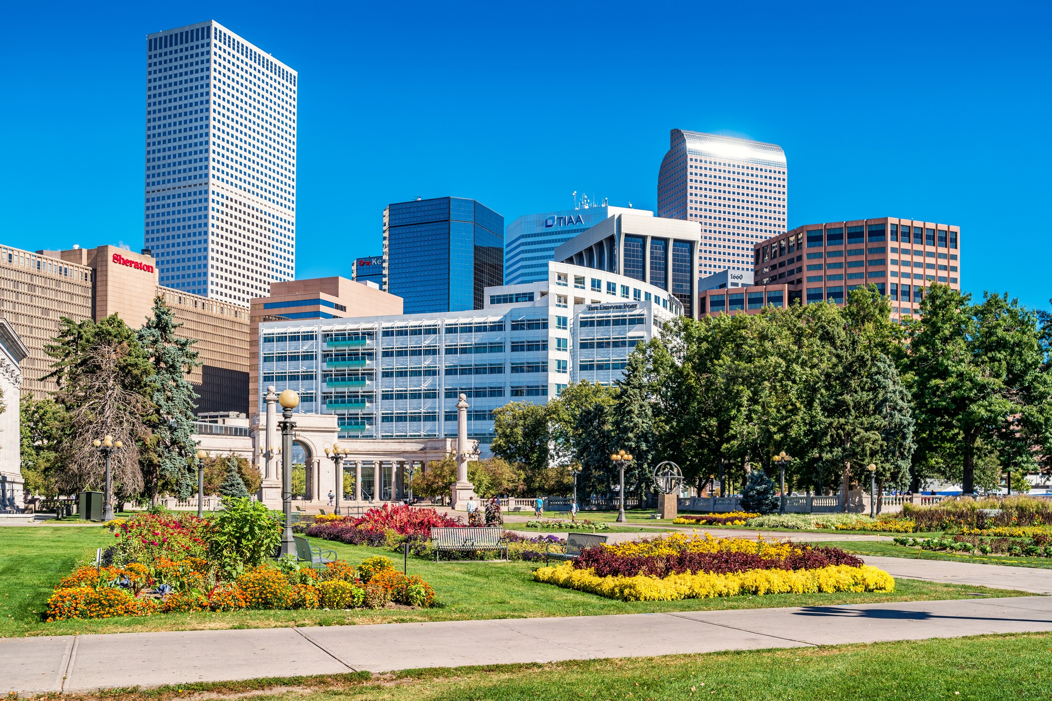 Downtown Denver skyline with flowers and green park