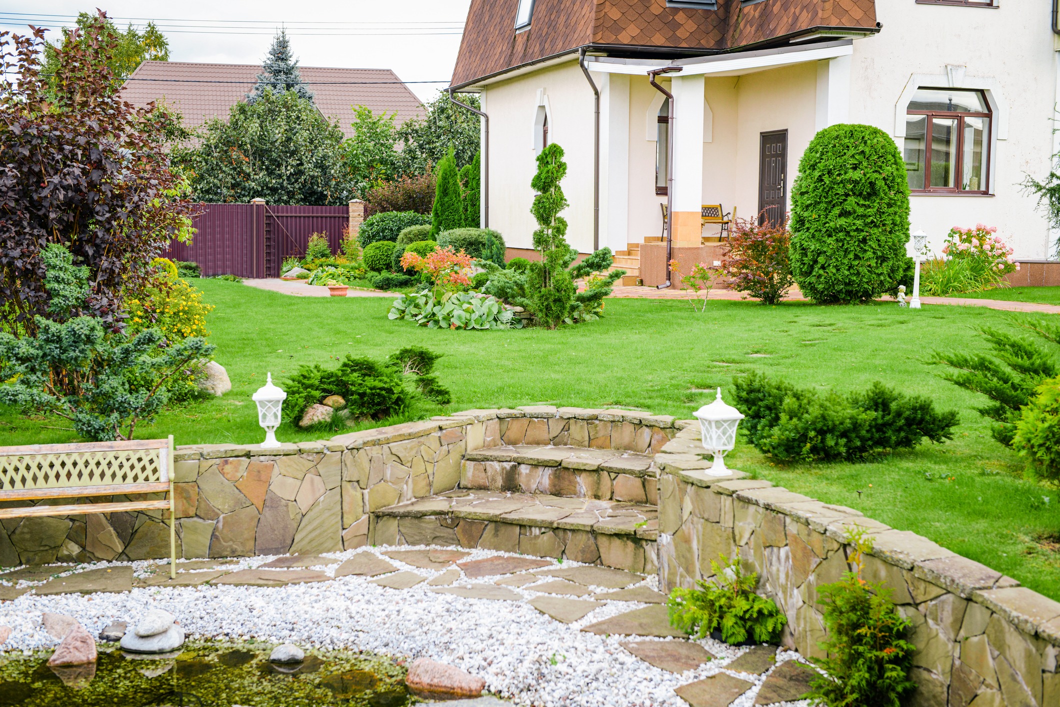 Lush garden and patio in front of a house