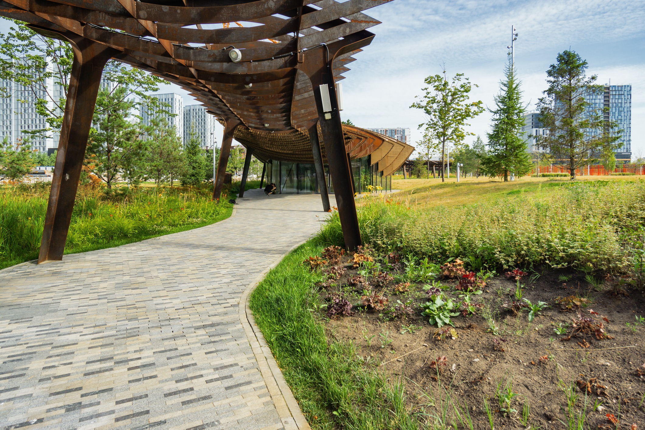 Modern park with winding path and architecture