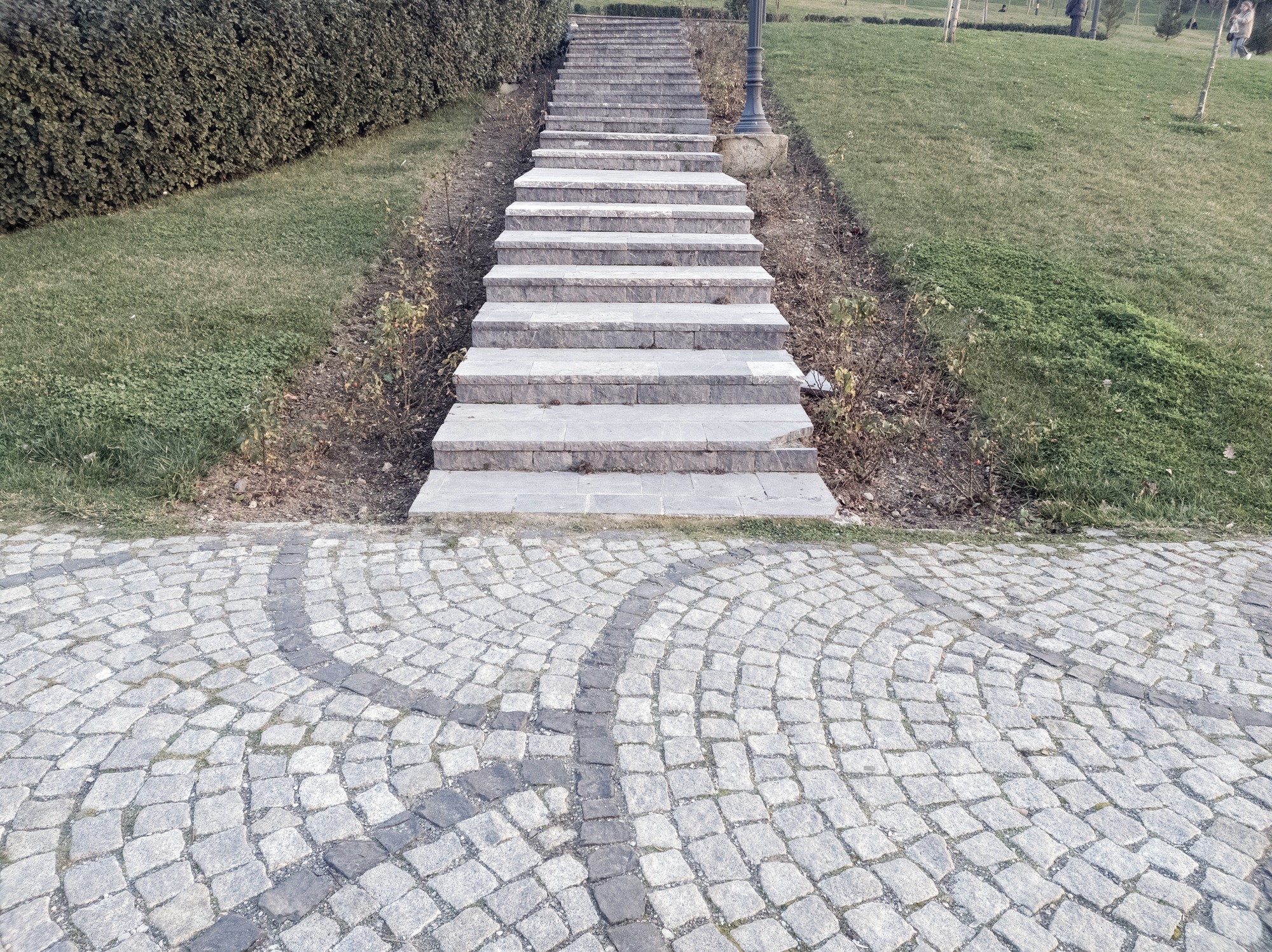 Stone steps leading up from cobblestone path